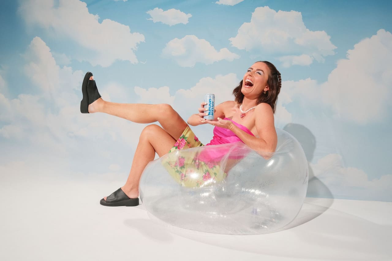 Campaign portrait in an inflatable chair, drink in hand